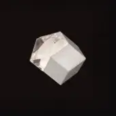 Geometric sculpture, white translucent and matte materials, asymmetrical faceted form with cube base, studio lighting.