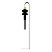 Floor lamp, matte black metal, curved stem with tiered black geometric lampshade and orange sphere detail on white background.