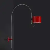 Arc lamp, scarlet red, with polished chrome arm and rectangular shade, mounted on a dark gray wall, studio lighting.