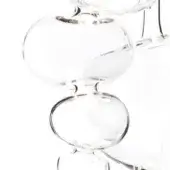 Glass sculpture, transparent acrylic, stacked spherical forms with cylindrical stem and pedestal bases, minimalist design, studio lighting.