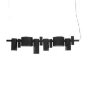 Pendant chandelier, matte black finish, features seven asymmetrically arranged cylindrical shades suspended from a slender white cord.