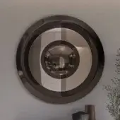 Elegant Ozzio Italia Dorian mirror with concentric circles of glass in a glossy bronze finish
