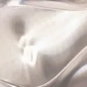Silver textile surface with ribbed linear texture, reflecting distorted light and iridescent highlights, smooth curvature, bright diffused lighting.
