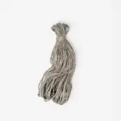 Jute cord bundle, muted gray-green, fibrous texture, teardrop shape, loosely knotted at top against a white background, natural material.