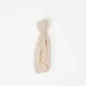 Tibetan wool bundle, off-white color, loosely gathered strands tied with a knot forming a vertical tassel shape against a white backdrop.