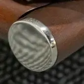 Furniture leg, dark brown woodgrain, cylindrical shape with brushed chrome circular cap and dark accent band.