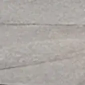 Light gray natural stone surface with horizontal linear striations, matte honed texture, and cool-toned variations creating a layered composition.