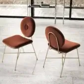Elegant Bontempi Penelope chair upholstered in textured terracotta velvet with golden metal legs and frame