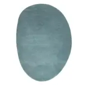 Teal ciclopi pietra mare rug, irregular shape, plush velvet texture, tonal variations, organic asymmetrical form, soft edges, diffused lighting.