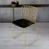 Distinguished Bontempi Freak chair with glossy golden metal frame and sleek black leather seat crafted in Italy