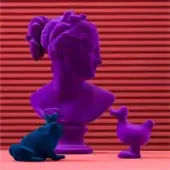 Cassoni Adriani Rossi Venus Italica velvet sculpture, purple bust with teal frog & duck on pink surface, red lined backdrop.
