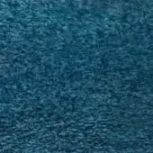 Teal velvet fabric texture with irregular ripples, displaying a plush surface and subtle sheen; “egoitaliano” brand detail visible.