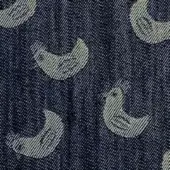 Denim textile with repeating crescent moon pattern in off-white, featuring a woven texture and striped details, labeled “denim cucu edition”.