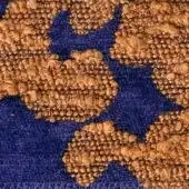 Kosmo Blucle fabric, navy and golden-brown, repeating floral pattern with textured nubby surface; Egoitaliano 1920 variation.
