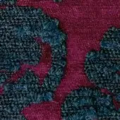 Burgundy and teal-blue fabric texture, woven base with looped motifs, labeled “egoitaliano kosmo blucle 1920”, matte finish, close-up view.
