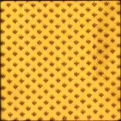 Repeating floral textile pattern in warm yellow and rust brown, featuring a distressed texture and all-over design, identified as egoitaliano bounce fabric.