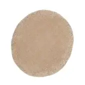 Circular Rugiano rug, sabbia color, dense shag pile with irregular edges and uniform velvety texture against a white backdrop.