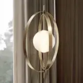 Captivating Bontempi Papillon floor lamp crafted in delicate metal with satin warm golden finish and elliptical rings encircling opaque glass