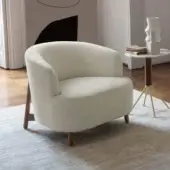 Distinguished Porada Copine armchair with soft bouclé textile upholstery and satin-finish wooden frame