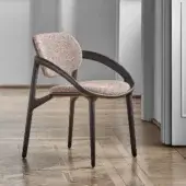 Distinguished Porada Molly armchair with a continuous canaletto walnut frame and neutral textured textile upholstery with matte finish