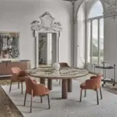 Architectural Porada Sansiro round table with a polished marble top showcasing cream, beige, gray, green and brown veining in canaletto walnut