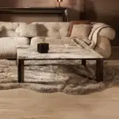 Elegant Visionnaire Vixen coffee table with beige and cream-veined marble top and polished stainless steel with textured aluminum base