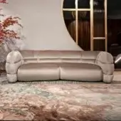Lavish Visionnaire Bomber sofa upholstered in plush matte dusty rose textile with uniquely padded chambers