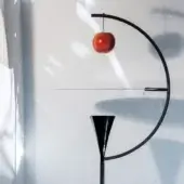Exceptional Nemo Newton floor lamp crafted in glossy black metal with a satin conical shade and vivid red apple