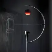 Captivating Nemo Newton floor lamp crafted in sleek metal with glossy silver finish and integrated red apple detail