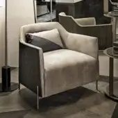 Exceptional Shake Hege lounge chair with curved ash-plywood frame, muted grey textile upholstery and varnished steel legs in a satin tone