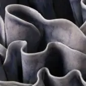 Distinguished FOS Ceramiche Antholia Blue vase crafted in white biscuit porcelain with a nuanced blue glaze and intricate madreporic textures