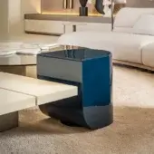 Distinguished Shake Blend side table with gently curved form and deep blue veneer wood structure with varnished steel base