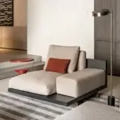Elegant Shake Mod chaise lounge upholstered in textured neutral beige fabric with a dark matte wooden frame and varnished steel legs