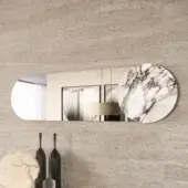 Distinguished Dallagnese Juno mirror with an oval shape and circular stoneware insert in white and warm brown tones, boasting a polished glass surface