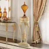 Lavish Modenese Rubino Delight vase stand crafted in cream-colored wood with gilded accents and a dark marble top