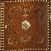 Classic walnut finish with gold leaf details and inlaid decorations