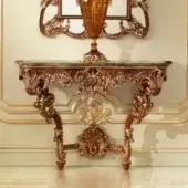 Distinguished Modenese Rubino Delight console with richly veined marble top and elaborately hand-carved walnut wood built with gold-leaf accents
