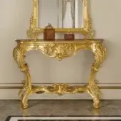 Distinguished Modenese Royal Blend console crafted in Italy with elaborate hand-carved details and a luxurious gold finish