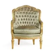 Distinguished Zanaboni Aura lounge chair crafted with gold and ivory patina, textured upholstery subtly toned gold and green, with ornate carvings