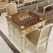 Distinguished Modenese Royal Symphony game table with creamy white satin wood, gold detailing and burgundy chessboard surface