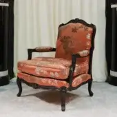 Distinguished Zanaboni Luigi XV lounge chair with terracotta upholstery and skilled wood carvings exhibiting a glossy finish
