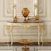 Distinguished Modenese Midnight Moon console with wood base and rich marble top in white with gold leaf detailing
