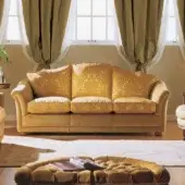 Exceptional Zanaboni Vendome sofa upholstered in golden yellow textile with button tufting and smooth finish