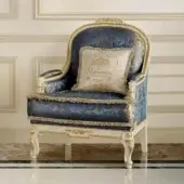 Distinguished Modenese Midnight Moon lounge chair with deep blue textile upholstery and opulent gold leaf accents