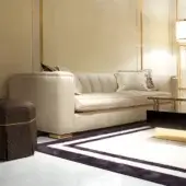 Distinguished Zanaboni Magritte sofa with enveloping silhouette and luxurious channeled velvet upholstery, built with gold-finish metal feet