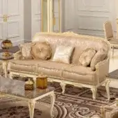 Lavish Modenese Midnight Moon sofa with cream and gold fabric upholstery and exquisite gold leaf accents