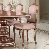 Exquisite Modenese Noble Etiquette chair in pale pinkish-beige textile with skilled carvings and glossy wood finish