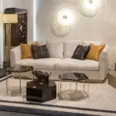 Elegant Zanaboni Morgana sofa with light neutral beige tactile fabric upholstery and satin brass recessed base