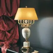 Exquisite Laudarte Ulmus table lamp with gilded metal base, textured column and warm golden-yellow lampshade crafted by Italian artisans