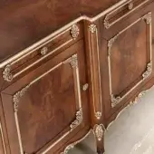 Classic walnut finish, with radica panels and silver leaf details